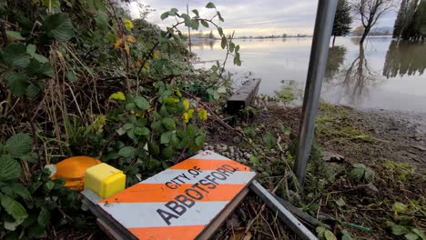 A-road-sign-of-the-City-of-Abbotsford-on-the-ground-after-flooding-in-Canada