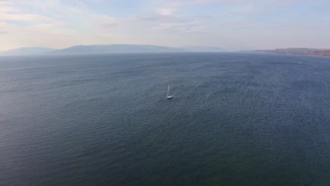 Overhead-Aerial-View-Of-A-Solo-Boat-At-Sea