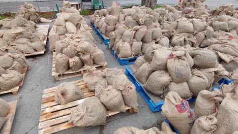 Circular-view-of-many-sandbags-piled-up-on-pallets-before-being-used