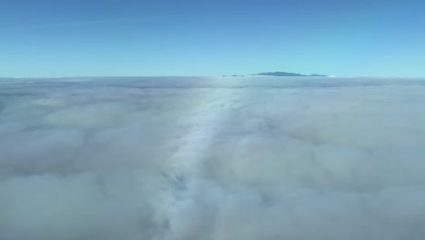 Aerial-view-from-cockpit-surfing-clouds-near-Gran-Canaria,-Canary-Islands