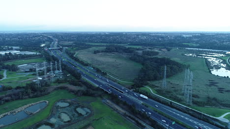 Long-steady-tracking-shot-of-traffic-traveling-along-Eastlink-tollway-in-Melbourne,-Australia