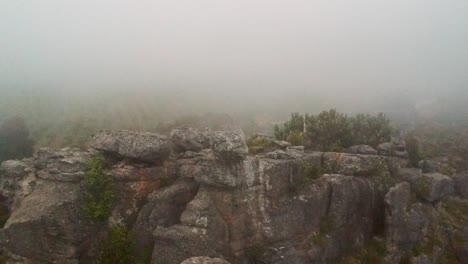 Rocky-mountain-outcrop-with-fog