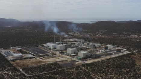 Aerial-view-of-a-gas-power-station-with-smoke-coming-out-the-chimneys