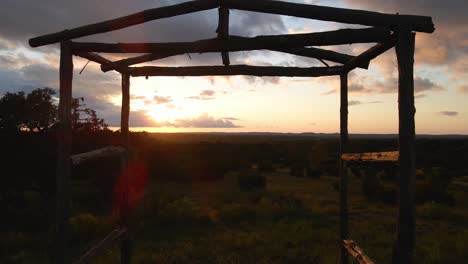 Drone-Through-Gazebo-and-Over-the-Hills-at-Sunset