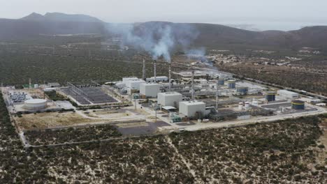 Aerial-view-of-a-power-station-emitting-smoke-in-the-middle-of-nowhere
