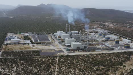 Gas-fired-power-plant-emits-smoke-and-pollution-in-a-desert-in-Baja,-Mexico