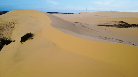 An-aerial-zoom-in-shot-of-white-sand-dunes-of-Mui-Ne,-Vietnam