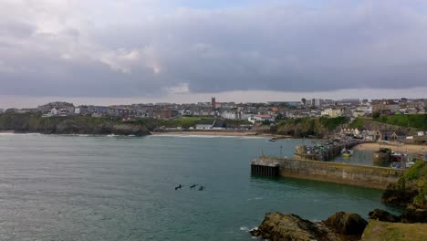 Aerial-Footage-Of-Sea-Kayakers-Leaving-Newquay-Harbour,-England