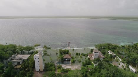 Milum-Lake-Club-at-Nopalitos-lake-in-Tulum-yucatan,-Mexico,-Aerial