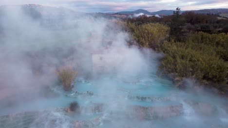 The-geothermal-hot-springs-bath-and-waterfall-at-Saturnia,-Tuscany-Italy-close-to-Siena-and-Grosseto-at-sunrise
