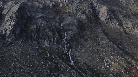 Aerial-view-of-a-gorgeous-waterfall-in-the-mountain-valley