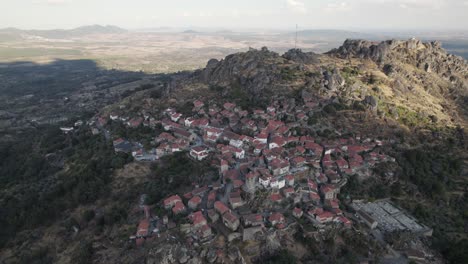 Wide-aerial-shot-of-Monsanto-historical-village-in-the-top-of-rocky-boulder-hill
