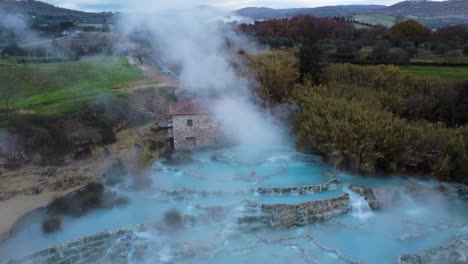 Famous-travel-destination-Saturnia,-geothermal-hot-springs-bath-and-waterfall-in-Tuscany-Italy-close-to-Siena-and-Grosseto