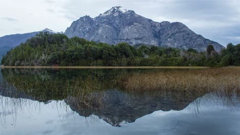 Time-Lapse-of-evening-from-Lake-Moreno-mirroring-Cerro-Lopez-and-the-intense-movement-of-the-clouds-in-Bariloche,-Patagonia-Argentina