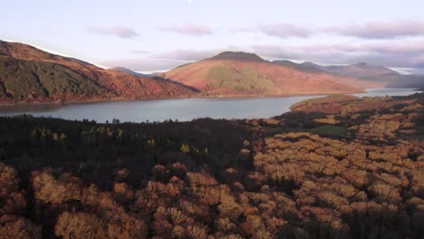 Rolling-aerial-drone-footage-of-Beinn-Bhreac,-the-slopes-of-Beinn-Dubh-and-Loch-Lomond-in-Loch-Lomond-and-the-Trossachs-National-Park,-revealing-Dubh-Lochan-close-to-the-West-Highland-Way,-Scotland