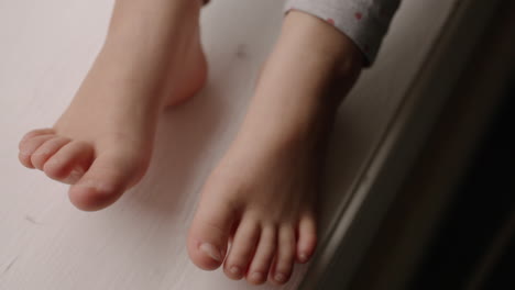 Close-up-of-a-little-kid's-bare-feet
