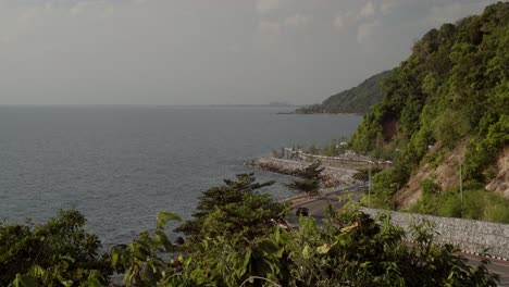 A-static-shot-of-the-beautiful-scenic-view-from-the-Noen-Nangphaya-viewpoint,-in-the-distance-the-Chaloem-Burapha-Chonlathit-Road-runs-along-the-coastal-shoreline-in-Chanthaburi,-Thailand