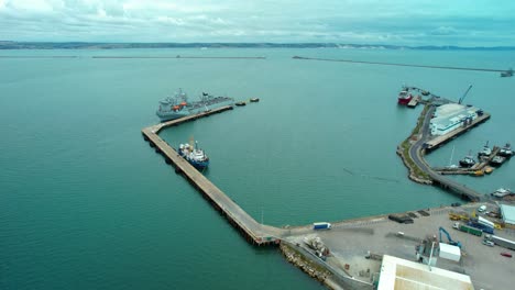Aerial-view-over-Argus-Royal-fleet-auxiliary-British-military-floating-hospital-ship-moored-at-breakwater-harbour