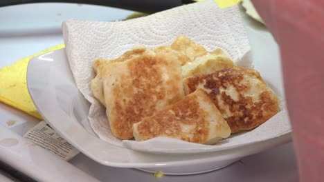 Fried-cheese-on-a-plate-with-absorbent-paper