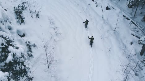 Snowshoeing-Aerial-on-Vancouver-Island,-Canada