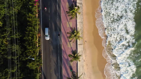 Aerial-flying-over-scenic-coastal-road-at-golden-hour