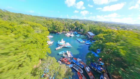 Aerial-fpv-flight-over-Gri-Gri-Lagoon-with-marina-and-yachts-between-dense-mangroves