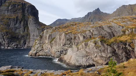 Dramatic-mountainous-steep-cliffs-at-the-shore-of-Lofoten