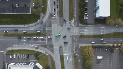 Peaceful-Iceland-road-intersection-with-traffic-crossing-streets,-top-down