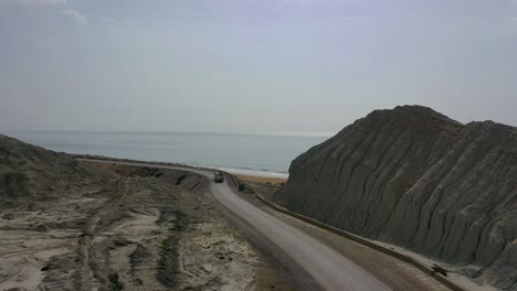 Bus-Traveling-Along-Coastal-Road-Beside-Arabia-Sea-In-Balochistan