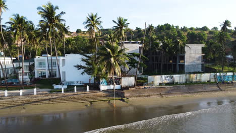 Calm-luxury-seaside-resort-with-palm-tree-in-early-morning,-Mui-Ne,-Vietnam