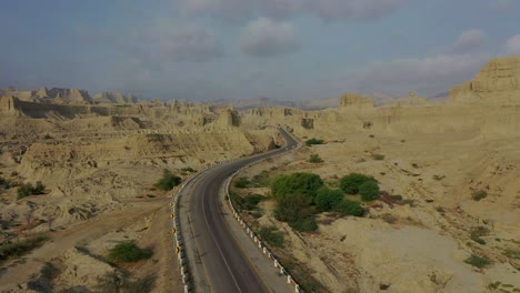 Aerial-Along-Empty-Highway-Road-Through-Rugged-Hingol-National-Park-In-Balochistan-Desert-Landscape