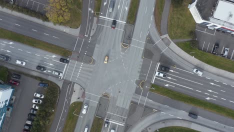 Light-traffic-road-junction-in-suburban-Reykjavik,-top-down-aerial
