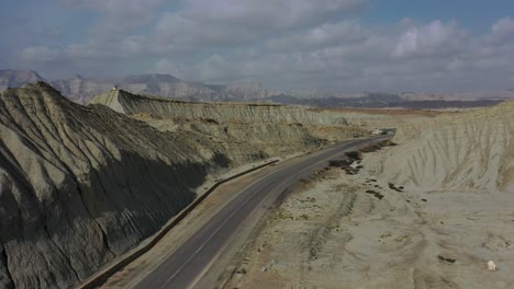Aerial-View-Of-Empty-Highway-Road-Through-Rugged-Balochistan-Desert-Landscape