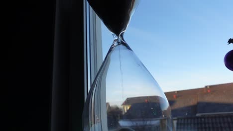 hour-glass-in-front-of-the-window