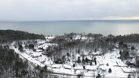 Panning-across-Lake-Michigan-Homes-and-Coastline-in-winter