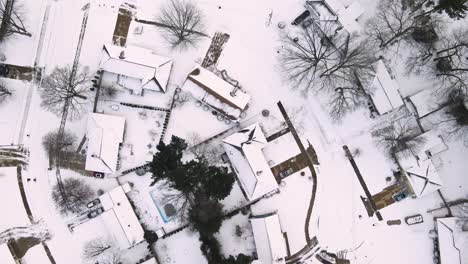 Descending-over-neighborhood-of-snowcapped-roofs