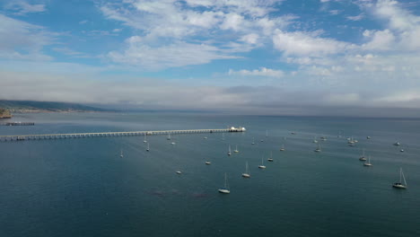 Slow-moving-aerial-shot-over-the-harbour-and-pier-at-San-Luis-Obispo,-California