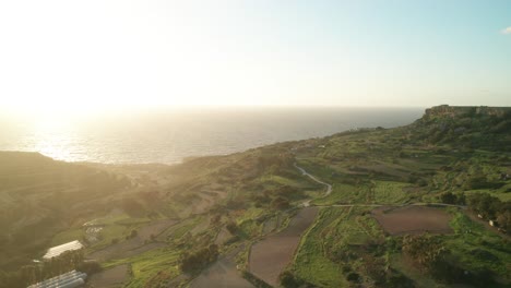 AERIAL:-Farms-Near-Coastline-of-Malta-During-Winter-on-a-Very-Sunny-Golden-Hour-Evening
