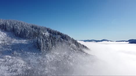 Aerial-Snowy-Mountain-Fog-on-Vancouver-Island,-Canada