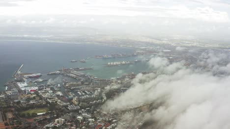 Long-aerial-shot-of-clouds-hovering-over-Cape-Town,-South-Africa