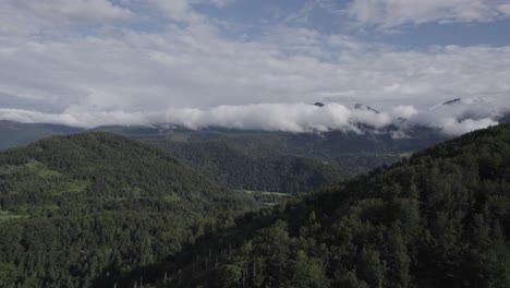 Drone-video-from-the-front-plane-flying-over-the-Triglav-mountains-in-the-Bohinj-area-in-Slovenia-with-a-clear-sky-with-clouds