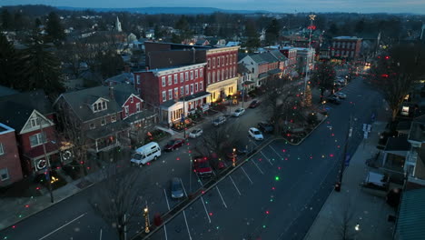 Aerial-of-Christmas-lights,-tree-in-town