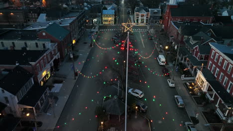 Aerial-of-small-town-in-USA-with-Christmas-star-and-lights-at-night