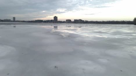 Ice-layer-covering-a-lake-surface-winter-season