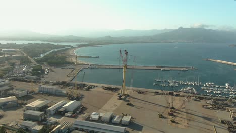 Drone-footage-of-arbatax-ferry-port-in-Sardinia-island,-Italy