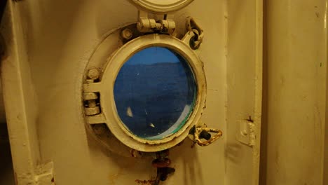 View-of-a-metal-Ship-porthole-from-inside
