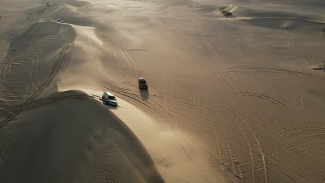 4K:-Drone-view-of-a-4x4-stuck-in-the-sand-during-the-desert-safari-in-the-Al-Qudra-desert-of-Dubai,-United-Arab-Emirates