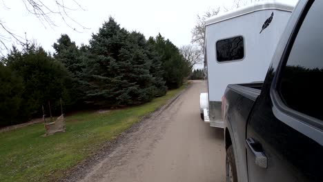 Hauling-a-horse-trailer-on-a-dirt-road-in-Southeast-Michigan---4K