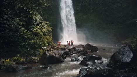 Bali,-Spring-2020-in-1080-60p,-Daytime,-cinematic-drone-flight-Long-slow-motion-up-flight-in-front-of-a-Waterfall