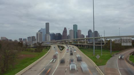 Timelapse-of-cars-on-I-45-North-freeway-with-downtown-in-the-background-in-Houston,-Texas